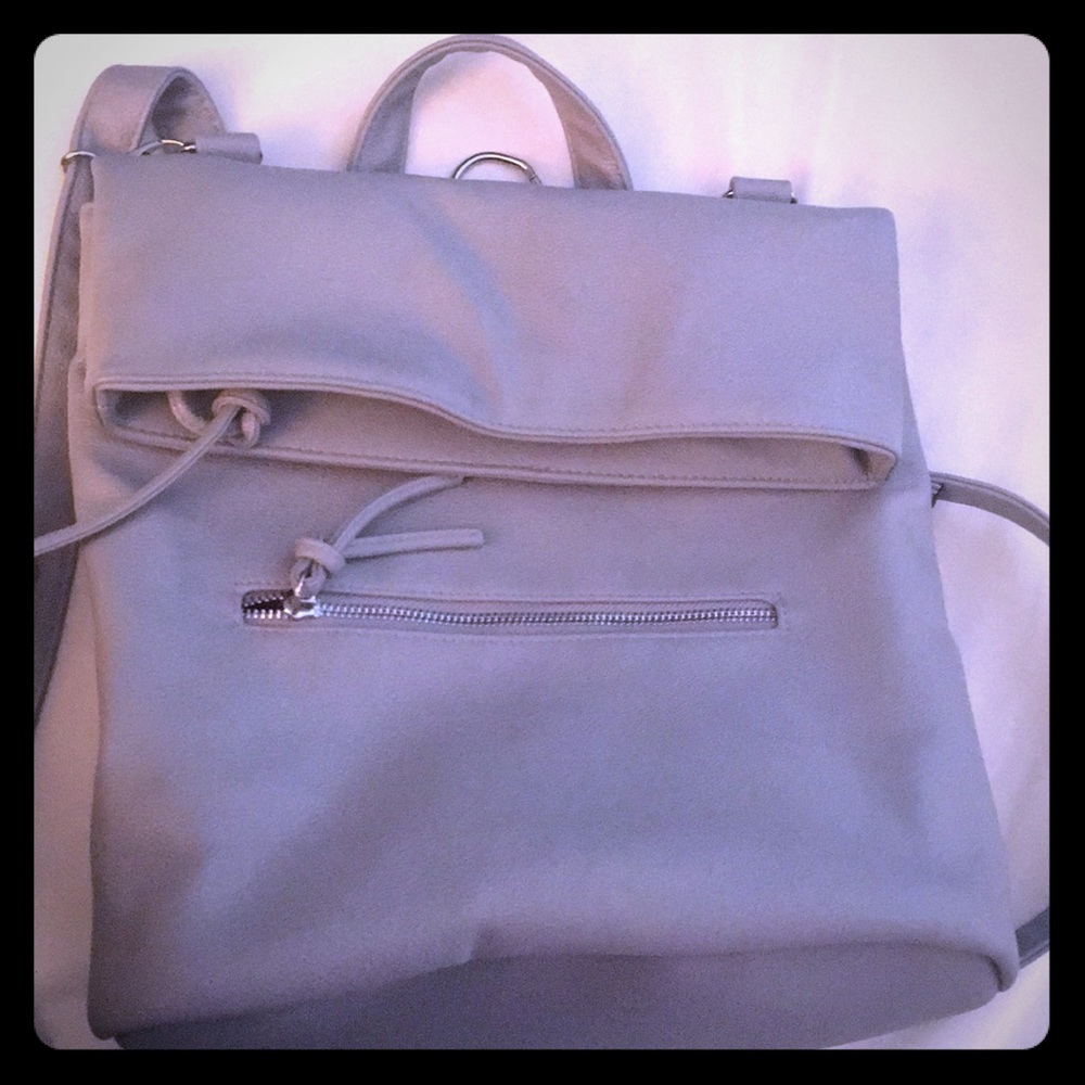 Never used Convertible faux leather grey backpack